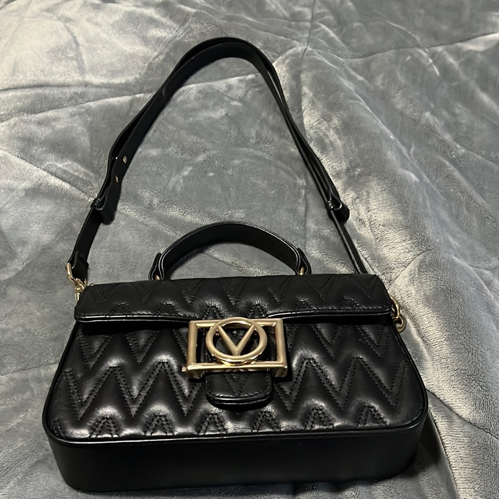 Medium black Mario Valentino leather with gold Valentino emblem magnetic closure